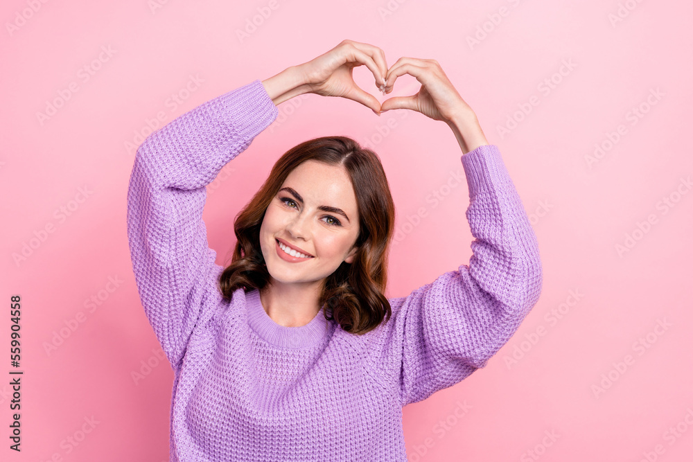 Sticker Photo of cheerful gorgeous lady wear violet comfort clothes arm under head demonstrate heart isolated on pink color background