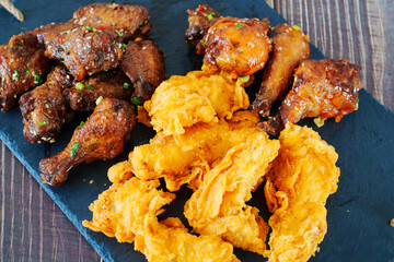 caramelized chicken with sesame and garlic, meat strips in breadin.