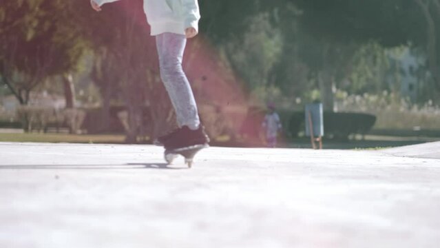 Legs on waveboard close up, Girl riding on casterboard with two wheels, modern street skate sports of teenagers, ripstick for balance ride.
