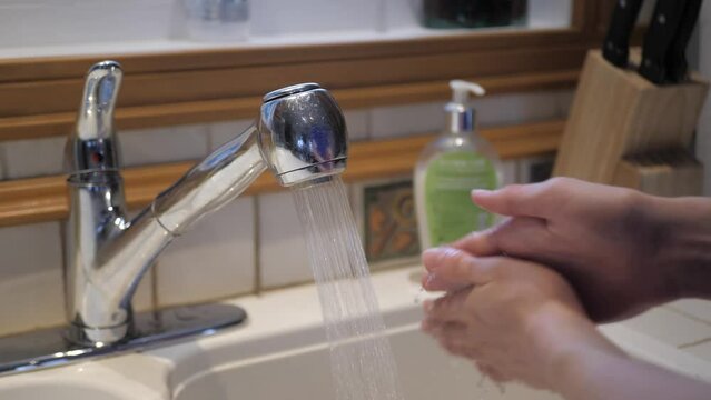 Washing hands in the kitchen