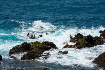 Lava stones in the surf