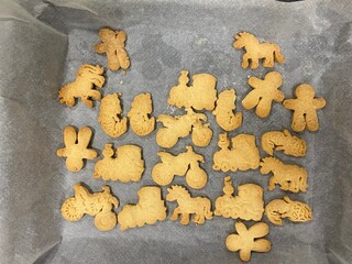 Home made biscuit cookies with different toy shapes like unicorns mermaids trains and motorbikes