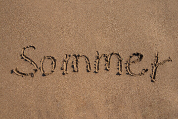The word summer is written on the sand, beach. Postcard with copy space. The concept of vacation, resort, tourism, business, travel, relax, hotels, sanatorium, holidays, poster, text,beachl, mockup.