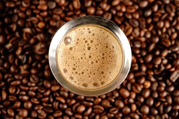 South Indian filter coffee served in steel cup and saucer, selective focus