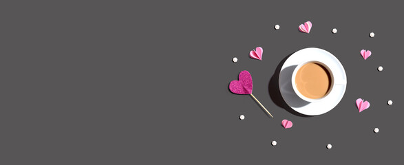 A cup of coffee with paper hearts - flat lay