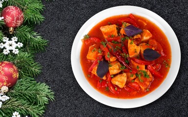 Tasty fresh hot dish with a Christmas branch