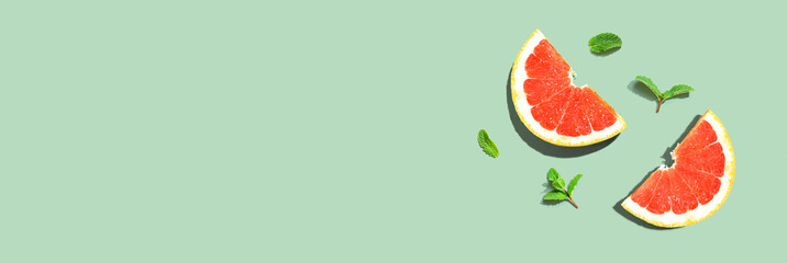 Fresh grapefruits and mints overhead view - flat lay
