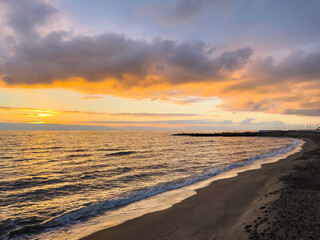 Colourful sunset in Ostia beach during winter (Rome, Italy).