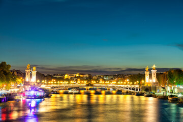Obraz premium Pont Alexandre III bridge at sunset over Seine river in Paris. France