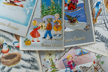 Old retro french postcards with the words Bonne Annee what is translated Happy New Year in French. French Christmas cards from the seventies