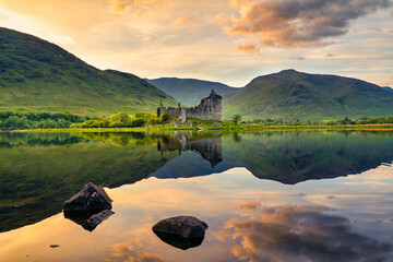 The ruins of Kilchurn castle at sunset in Scotland