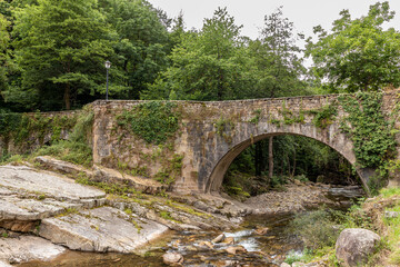 Fototapeta na wymiar bridge over the Argoza river in B rcena Mayor, Cantabria, Spain.