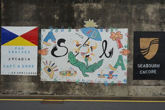 Seawall paintings of arriving sailors AIDAsol cruise ship Madeira Funchal 