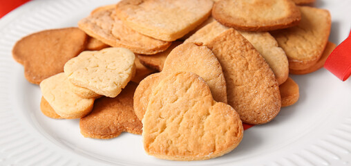 Plate of delicious heart-shaped cookies, closeup. Valentine's Day celebration