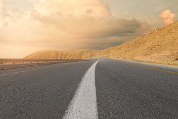Fototapeta na wymiar View of asphalt highway road in desert
