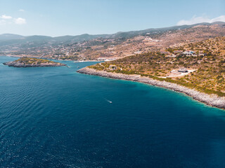 Fototapeta na wymiar Drone shot of Zakynthos island with beautiful turquoise Ionian sea and limestone cliffs near famous Navagio beach during daytime