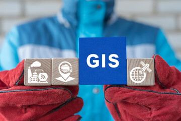 Engineer holding blocks with conceptual banner: GIS. Concept of GIS Geographic Information System...