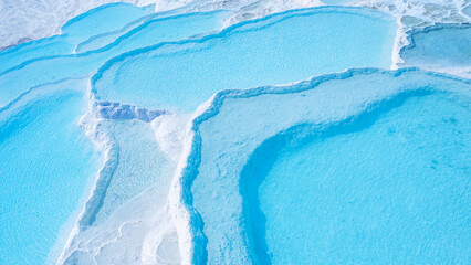 Denizli Pamukkale nature terraces travertine pools with blue water. Aerial top view landmark of Turkey
