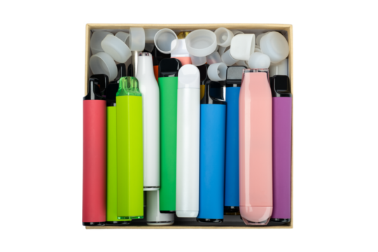 Synthetic nicotine concept. Various disposable electronic cigarettes in cardboard box. modern alternative smoking, vaping and nicotine. - Powered by Adobe