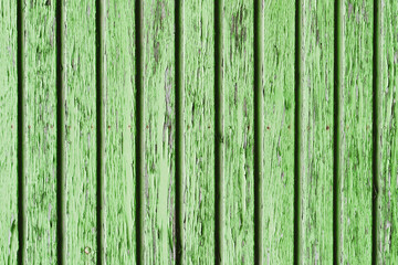 Fototapeta na wymiar Wooden desk background. Peeling paint pattern. Old peeling paint texture. Grunge cracked wall background. Green color weathered surface. Broken wood structure. Vintage pattern design.