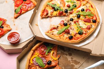 Cardboard boxes with tasty pizza, closeup