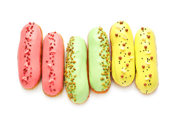 Various glazed eclairs isolated on white background