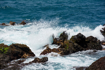 Lava stones in the surf