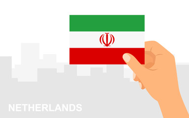 Hand holding the flag of Iran on the background of the city in minimal flat style. Vector illustration