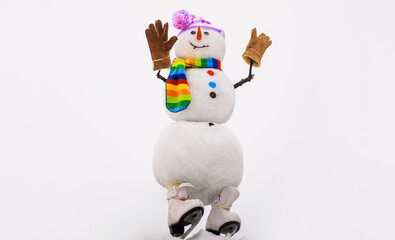 Snowman in hat, scarf and mittens with ice skating. Happy winter holidays.