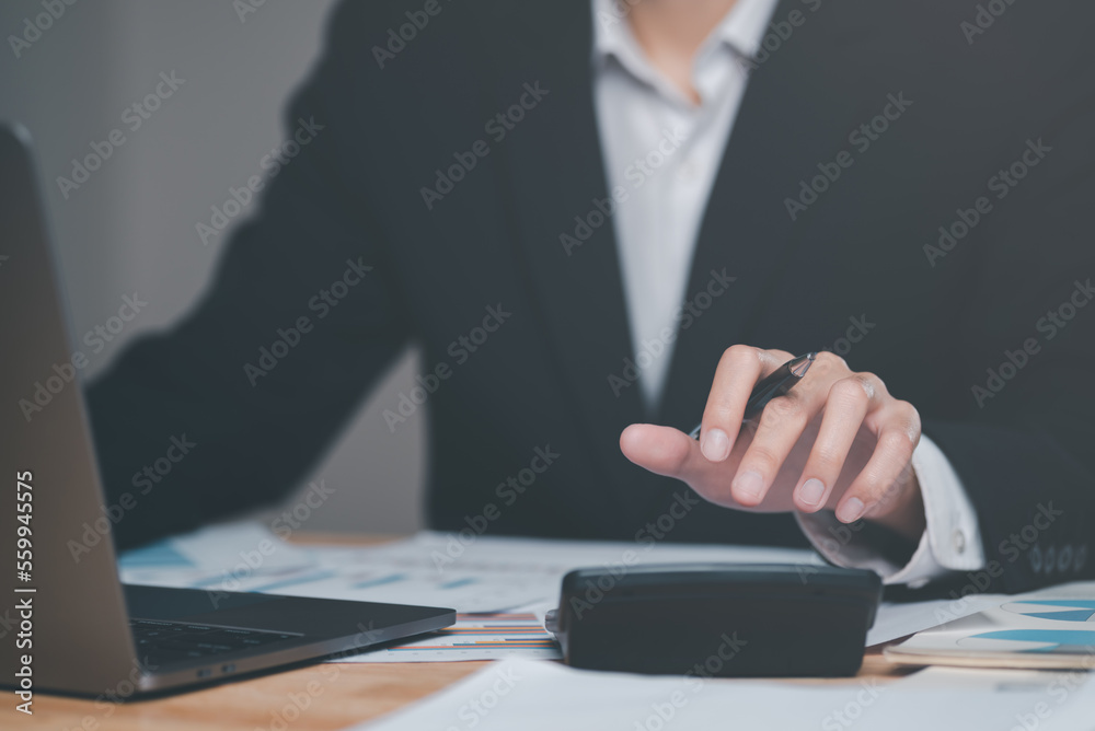 Poster businessman calculating figures in company financial documents with a calculator,analysis of company