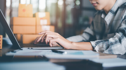 Startup or small business entrepreneur,check business growth report,order management in online stores, shopping on the internet,Selling online on the Internet,SME,shipping boxes,e-commerce