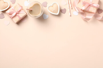 Happy Valentines Day concept. Frame border made of gift boxes, heart shaped candles, cup of coffee, decorations on pastel beige background. Valentines card template.