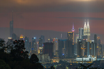 Obraz premium Kuala Lumpur city view from during sunset overlooking the KL city skyline