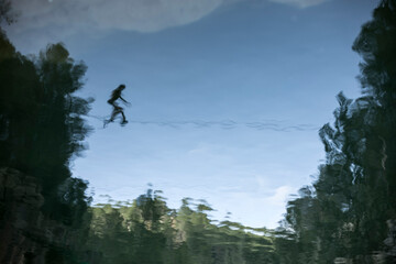 Reflection of a slacker walking on a line in Montanejos