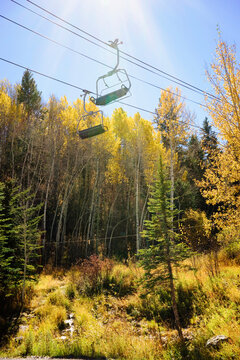 Golden Fall foliage and a ski chair lift