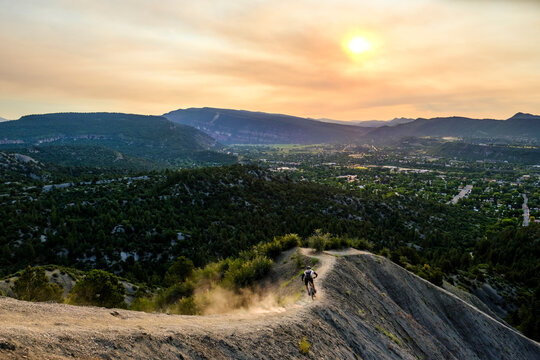 Male Mountain Biker rides down Hogs back near Durango, Colorado, USA