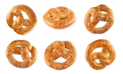 Set with tasty freshly baked pretzels on white background
