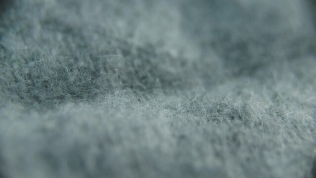 Texture of grey soft textile  rotating close up. details, macro shoot
