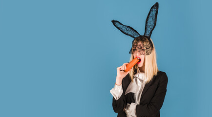 Bunny woman with carrot. Easter rabbit girl with black ears. Wide photo banner for website header design.