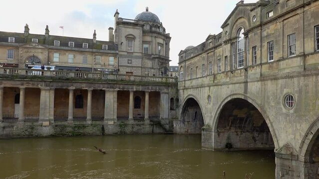 The Pulteney Bridge in Bath, UK.  A bridge with shops either side.  Winter