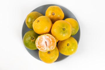 Fresh peeled orange tangerine  isolated on white background