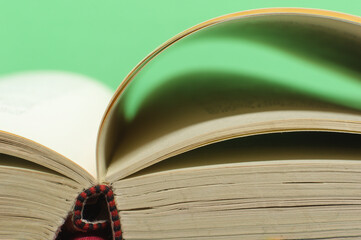 closeup open book spine pages turning