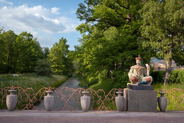 View of the Large Chinese Bridge in Alexander Park in Tsarskoye Selo on a sunny summer day,...