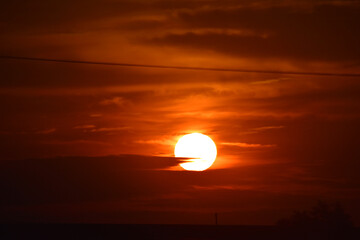 Setting sun against a dim background