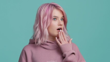 Oh my god WOW. Amazed excited woman with pink hair opened mouth in surprise 4K
