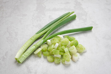 Whole and cut fresh leeks, food ingredient
