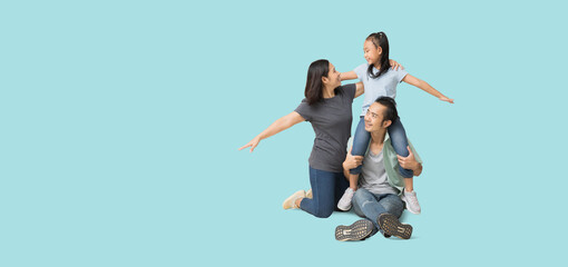 Happy smiling young asian family with neck playing sitting on floor and have a fun time together, Full body isolated on pastel plain light blue background