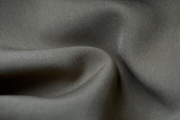 Grey fabric background. Grey cloth waves background texture. Grey fabric cloth textile material.