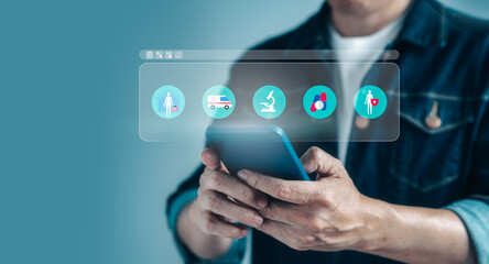 Businessman hand holding virtual medical health care icons on mobile application