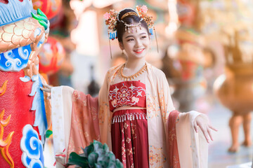 Portrait smile Cute little Asian girl wearing Chinese costumes decoration for Chinese new year...